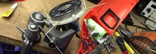 Vacuum cleaner repair parts and tools on a workbench in Chicago, IL